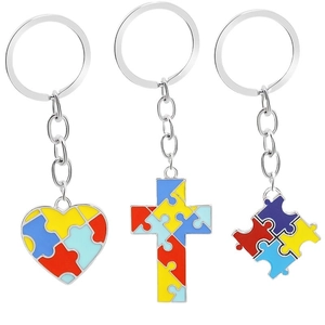 Colorful enamel puzzle pieces keychain set with heart and cross shapes on silver metal