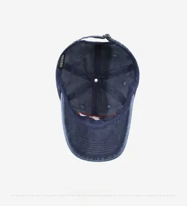 Detail view of cotton baseball cap interior showing seams, wash label, and metal buckle