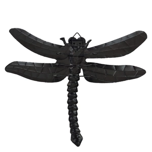 Detail view of black metal dragonfly wall decor with textured wings and hanging loop