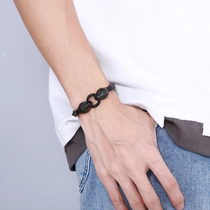 Close-up of men's black titanium steel snake head link bracelet with a punk rock design