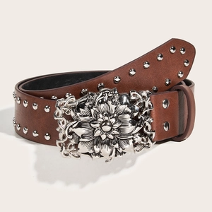 Brown vintage leather belt featuring floral embossed silver buckle and round metal studs