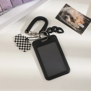 Close-up of black card holder with spring rope and checkered cloud charm accessory