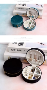 Internal details of velvet jewelry box featuring necklace hooks and ring slots