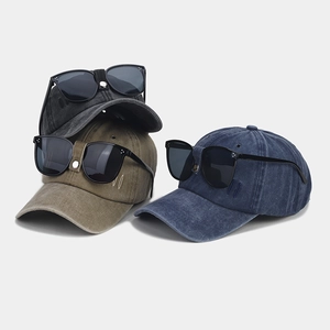 Detail of vintage washed baseball caps with integrated sunglasses in various colors