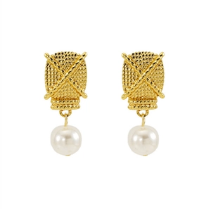 Detailed macro view of woven gold texture and white pearl earring with 18K finish