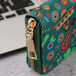 Gothic skull wallet in green with Mexican Day of the Dead pattern and gold zipper detail