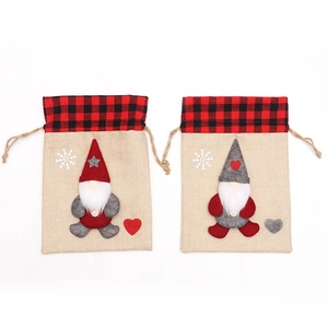 Christmas gnome drawstring candy bags in linen fabric with festive red and grey felt hats