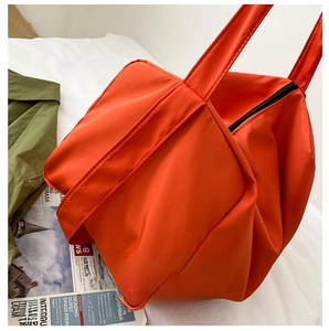 Detail of high-quality orange oxford fabric texture on this large capacity fitness tote