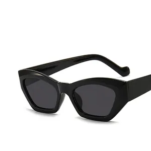 Occhiali da sole retrò cat-eye irregolari in nero lucido con montatura alla moda