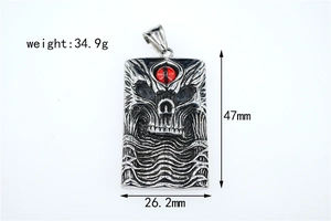 Detail view of gothic skull pendant with red eye showing 47mm height and 26.2mm width dimensions