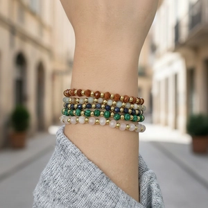 Detail of multi-layer natural stone bracelets with Amazonite beads and gold metal spacers