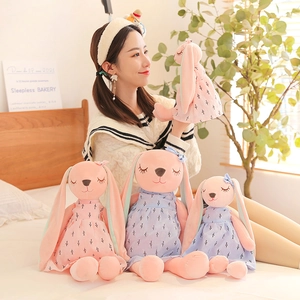 Pink and blue long-eared plush rabbits with floral dresses in various sizes