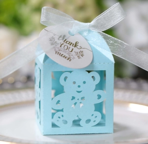 Detail of light blue hollow bear candy box with white ribbon and Thank You tag