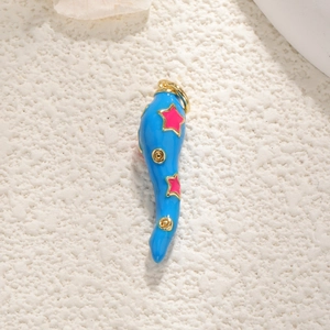 Detailed view of a blue enamel chili pepper pendant with gold trim and pink stars