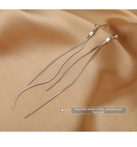 Detail view of long tassel earrings with S925 silver needles and smooth snake bone chain