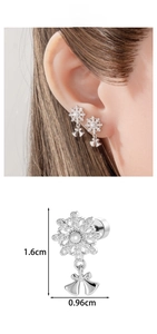 Macro shot of snowflake earring with bow pendant and white bead detail and dimensions