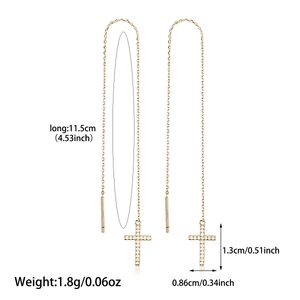 Detail of 925 silver gold cross earrings with dimensions 11.5cm length and zircon inlay
