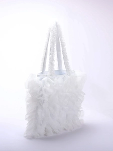 Detailed view of white pleated tulle handbag featuring soft lace ruffles and cake skirt design