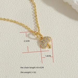 Macro shot of 14K gold plated paperclip chain with cubic zirconia mushroom pendant