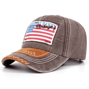 Detail showing vintage US flag patch embroidery on washed canvas baseball cap