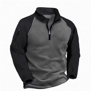 Detail of grey and black color-block tactical fleece pullover with arm zip pocket