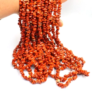 Macro shot of natural red jasper irregular stone beads for DIY jewelry making