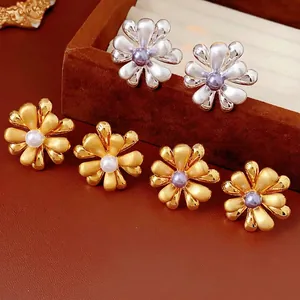 Elegant 18k gold plated flower stud earrings with pearl center in gold and silver finish