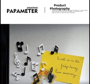Detail of musical note magnets featuring clef and staff symbols for fridge decor