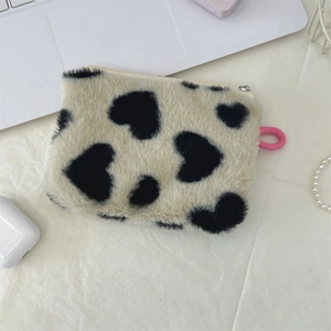 Plush rectangular pouch with black and white heart patterns and a pink zipper lanyard