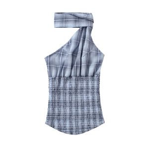 Close-up of blue and white plaid seersucker fabric with smocked texture and halter neck detail