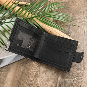 Close-up of black leather bifold wallet with multiple card slots and a clear ID window
