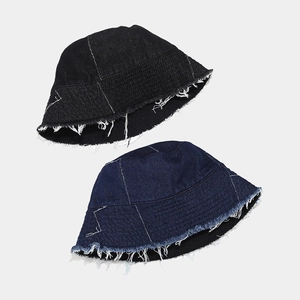 Denim bucket hat set in black and dark blue with raw fringe edges and white contrast stitching