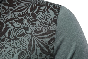 Macro shot of khaki polo shirt fabric with detailed floral print and piqué knit texture