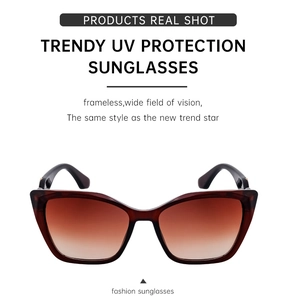Detail of trendy cat-eye sunglasses with brown gradient UV protection lenses