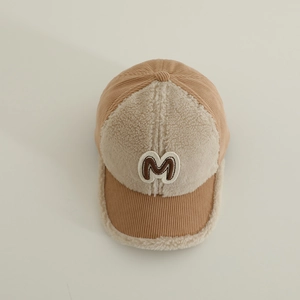 Detail of brown corduroy and beige faux lamb wool baseball cap with towel embroidered M