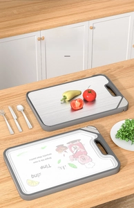 Dual-sided cutting board showing stainless steel and non-slip food-grade plastic surfaces