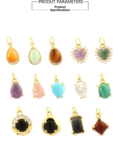 Macro view of assorted 18K gold-plated gemstone charms in heart and teardrop shapes