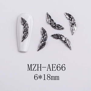 Detailed view of silver feather nail art charms with dimensions 6x18mm on white background