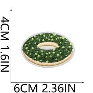Detail view of 6x4cm green donut embroidery patch with dimension measurements