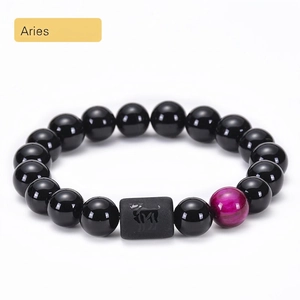 Aries zodiac bracelet with black onyx beads and magenta tiger eye stone detail
