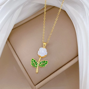 Elegant gold titanium steel necklace featuring a white resin rose and sparkling diamonds