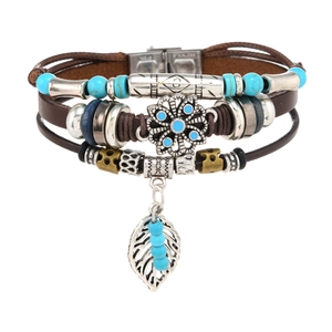 Detail of multilayer leather bracelet with turquoise beads and silver leaf pendant
