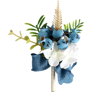 Forest style wedding boutonniere with blue berries, white flowers and green leaves