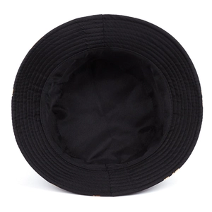 Close-up of the internal stitching and fabric structure of the black graffiti bucket hat