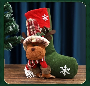Close-up of felt Christmas stocking featuring a 3D plush reindeer with snowflake patterns