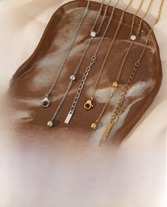 Detailed view of stainless steel Y-necklace with zircon in gold and silver finish