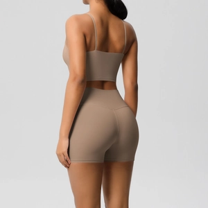 Rear view detail of mocha brown two-piece yoga set with thin straps and high waist shorts