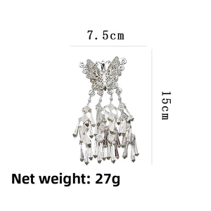 Detail of silver butterfly tassel hair clip showing 7.5cm width and 15cm height dimensions