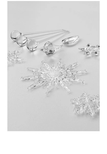 Macro detail of clear acrylic crystal snowflakes and icicles for Christmas decor