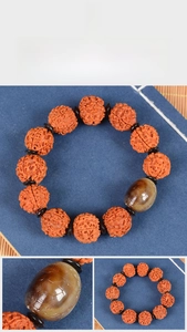 Macro shot of 5-mukhi Rudraksha beads with a hand-carved agate turtle bead